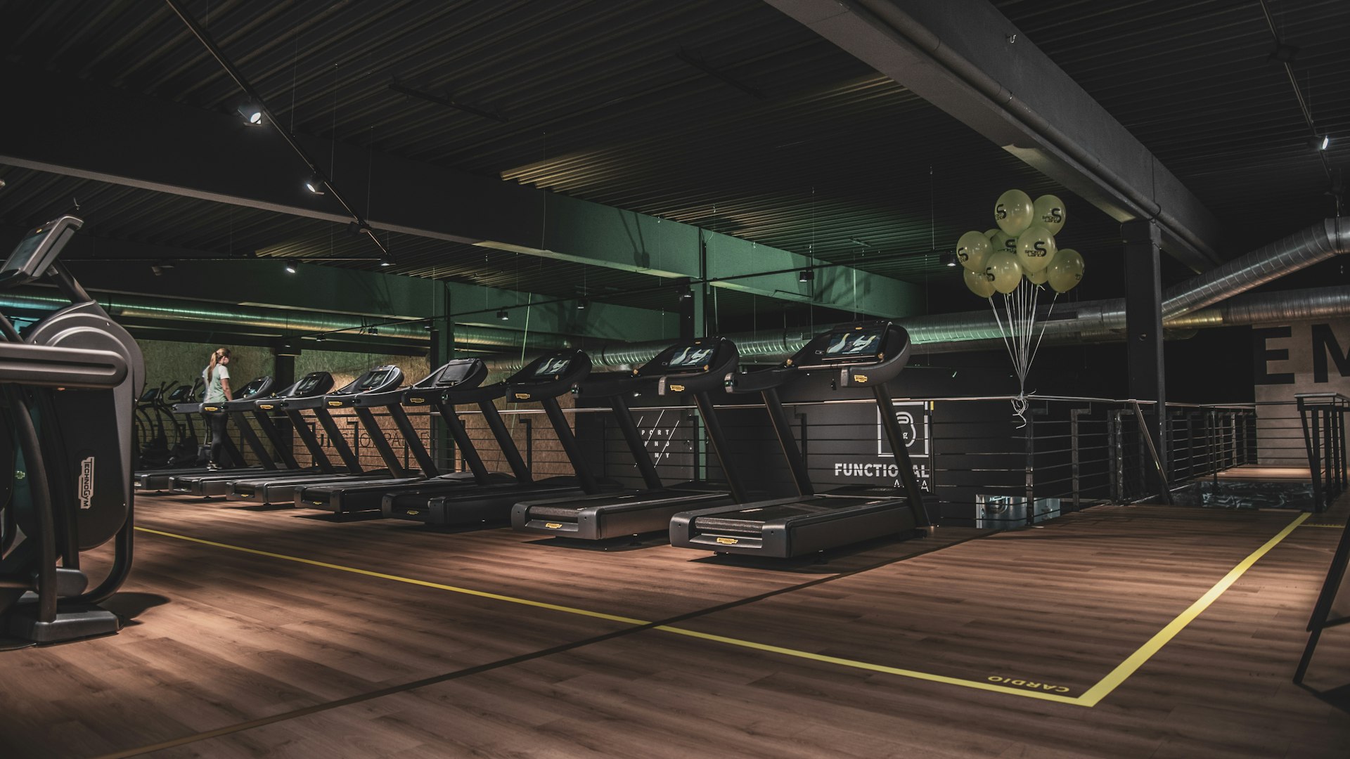 Modern gym training area with advanced equipment